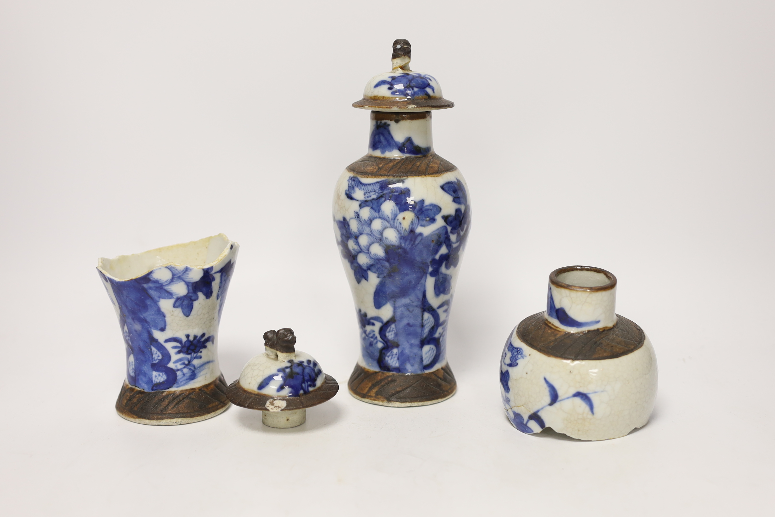 A pair of 19th century Chinese crackleware vases and covers, 15cm high (one badly broken)